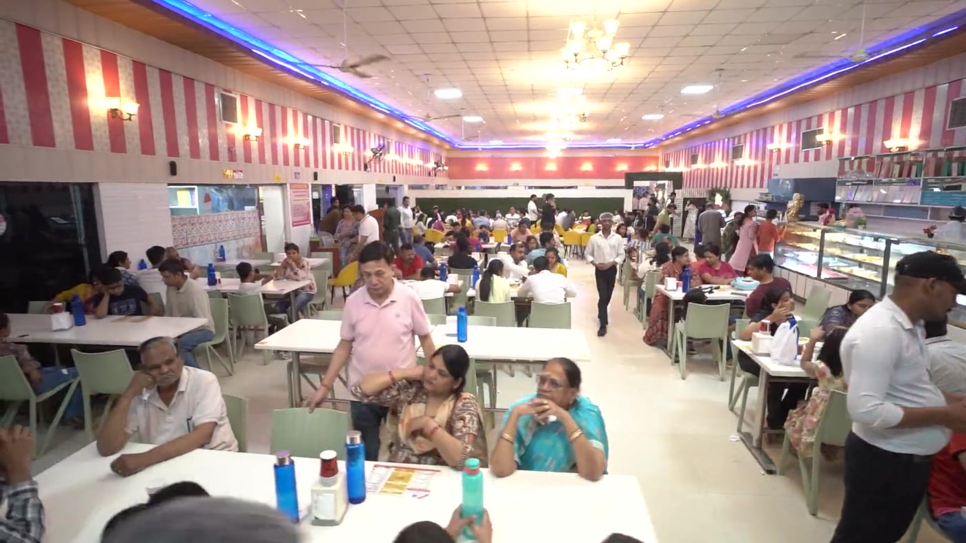 Guests dining in the pure vegetarian restaurant hall at Maa Restaurant and Sweets